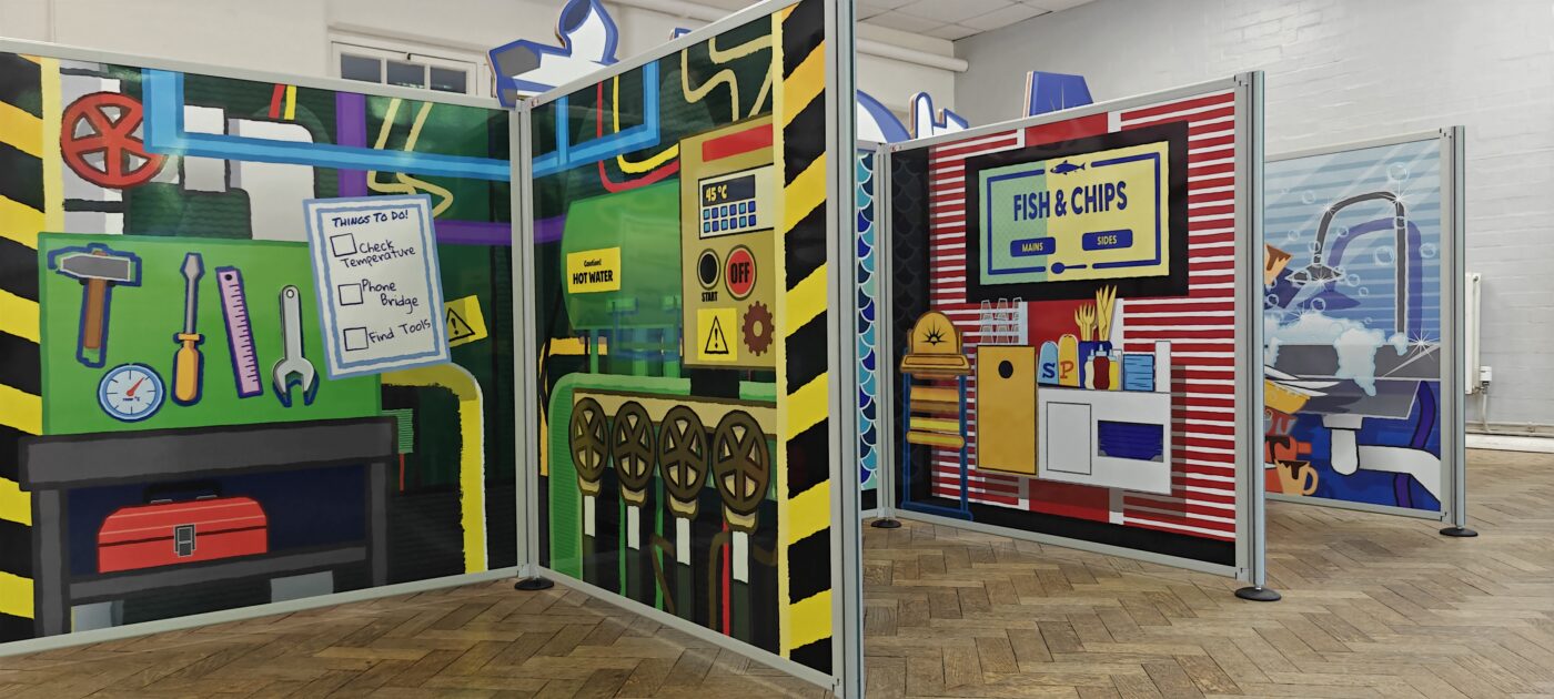 Complete flat-pack role-play village installation featuring freestanding scenic panels and interactive props ready for play onboard P&O Cruises.