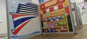 Complete flat-pack role-play village installation featuring freestanding scenic panels and interactive props ready for play onboard P&O Cruises.